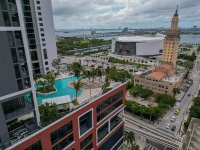 an aerial view of a city with a pool at Bayside Breeze - Downtown Luxury Tower in Miami