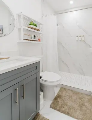 a white bathroom with a toilet and a shower at BOHO Elegance in the FLL city! in Fort Lauderdale