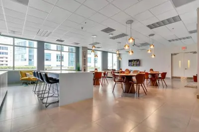 a large room with tables and chairs in a building at Stylish 1BR Brickell Condo with Balcony and Pool Access in Miami