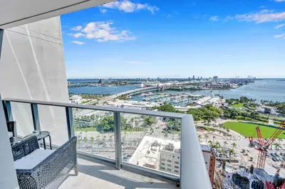 a balcony with a view of the water at Mesmerizing Water Views Corner Condo in Miami