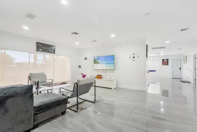 a living room with a couch and chairs in it at Emerald Hills Haven in Hollywood