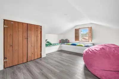 a bedroom with a large wooden closet and a large pink orb at Contemporary 4 Bedroom Oasis - Private Large Patio in North Miami