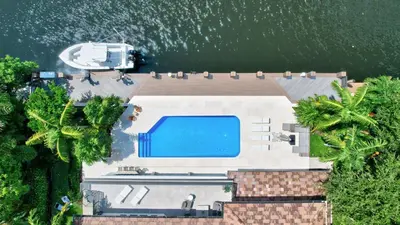 an overhead view of a house with a swimming pool at Elegant Waterfront Estate 6BR- 6.5BA in Fort Lauderdale