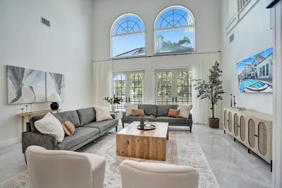 a living room with a couch and a table at Spacious Luxury Villa in Hollywood 6BR 5-Bath 5-Min Walk to Beach & Attractions in Hollywood