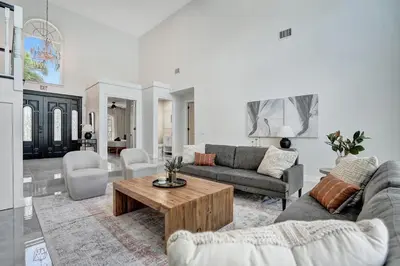 a living room with a couch and a coffee table at Spacious Luxury Villa in Hollywood 6BR 5-Bath 5-Min Walk to Beach & Attractions in Hollywood