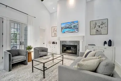 a living room with a couch and a fireplace at Spacious Luxury Villa in Hollywood 6BR 5-Bath 5-Min Walk to Beach & Attractions in Hollywood
