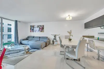 a living room with a couch and a table at Amazing 28th floor unit with Parking in Miami