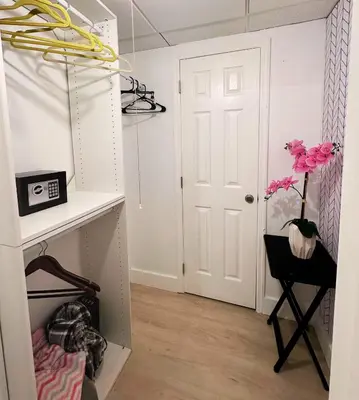 a room with a white door and a vase with a flower at Amazing beachfront condo at Tides on Hollywood Beach Luxury Resort in Hollywood