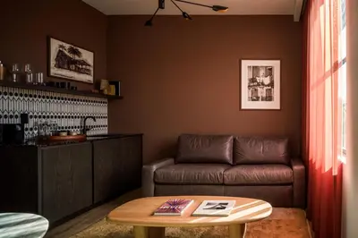 a living room with a couch and a table at The Rover Miami in Miami