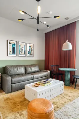 a living room with a couch and a table at The Rover Miami in Miami