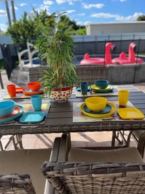 a table with plates and bowls on top of it at Flamingo Paradise in Hialeah