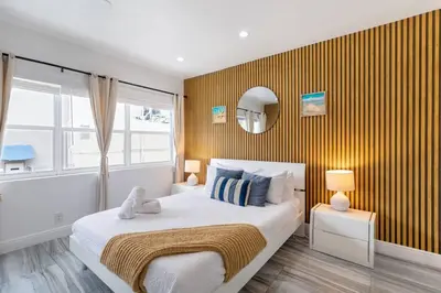 a bedroom with a large bed and a window at Ocean Views! Steps from Dining, Shopping, Las Olas in Fort Lauderdale