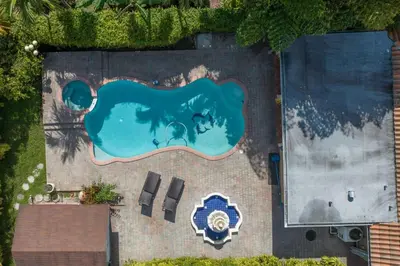 an overhead view of a swimming pool in a yard at Miami House - Heated Pool - Family Vacation in Miami