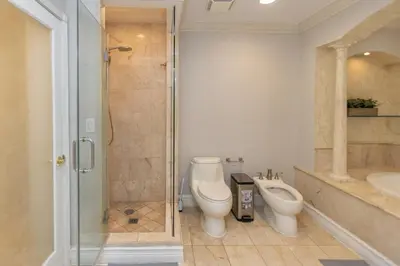 a bathroom with a shower and a toilet and a sink at Miami House - Heated Pool - Family Vacation in Miami