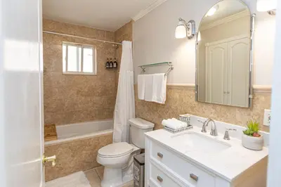 a bathroom with a toilet and a sink and a shower at Miami House - Heated Pool - Family Vacation in Miami