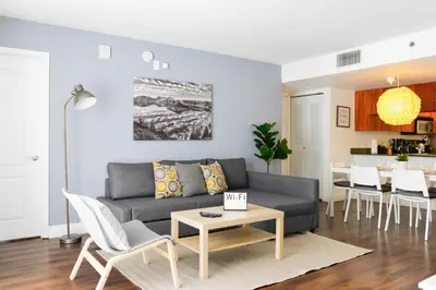 a living room with a couch and a table at Amazing Condo Brickell with Ocean-Pool View in Miami