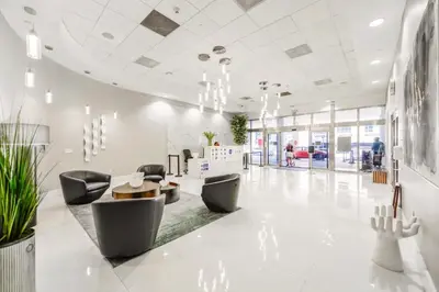 a lobby with chairs and a table in a building at Amazing Condo Brickell with Ocean-Pool View in Miami