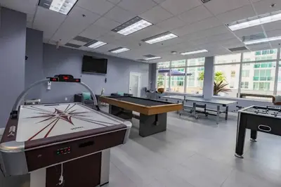 a large room with two ping pong tables in it at Spacious 29th Floor 1 BED 1 BTH Brickell Ocean View in Miami