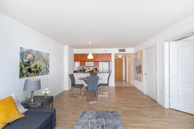 a living room with a couch and a table at Spacious 29th Floor 1 BED 1 BTH Brickell Ocean View in Miami
