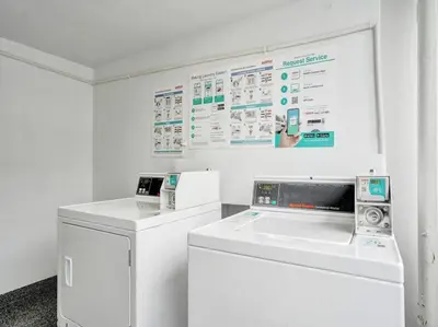 a white laundry room with a washer and dryer at Cozy Ocean View Condo Beach Service 610 in Miami Beach