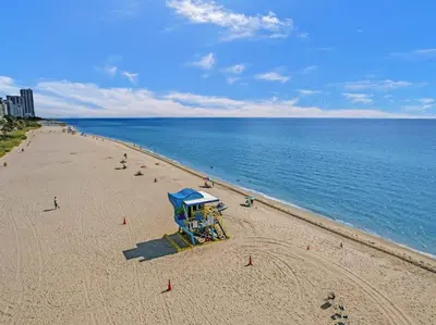 a beach with a life guard station on the beach at Cozy Ocean View Condo Beach Service 610 in Miami Beach