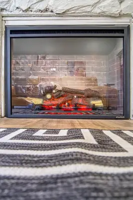 a fireplace with a brick wall with food on it at Casa Roselle # 1 in Hollywood
