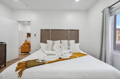 a bedroom with two white towels on a bed at Casa Roselle # 1 in Hollywood