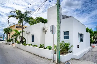 a white building with a stop sign on a street at Casa Roselle # 2 in Hollywood