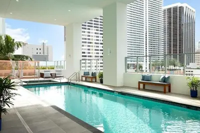 a swimming pool on the roof of a building at Stylish Downtown Miami Getaway 30th Story View in Miami