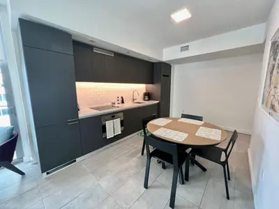 a kitchen with a table and chairs in a room at Stylish Downtown Miami Getaway 30th Story View in Miami