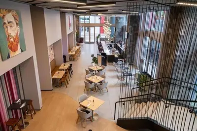 a restaurant with tables and chairs in a building at Stylish Downtown Miami Getaway 30th Story View in Miami