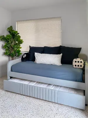 a blue couch in a room with a window at Newly Remodeled full Apartment in Miami