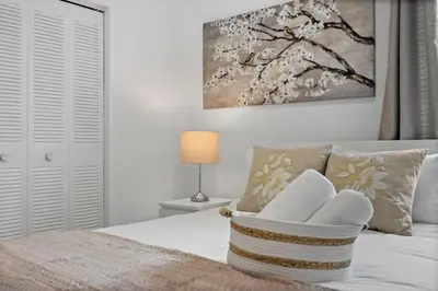 a bedroom with a bed with a basket on it at La Casita by TilahStays in Miami