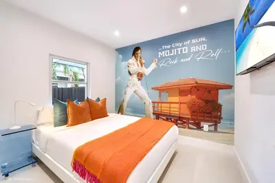 a bedroom with a poster of a woman standing on a bed at The Rock & Rhythm Villa Miami Downtown - Playground,Mini Golf, BBQ, Garden Relaxation in Miami