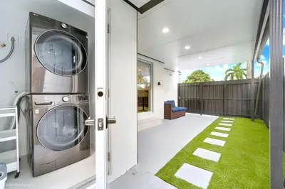 a laundry room with a washer and dryer in a house at The Rock & Rhythm Villa Miami Downtown - Playground,Mini Golf, BBQ, Garden Relaxation in Miami