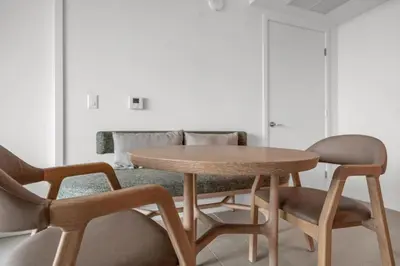 a table and two chairs in a living room at Stylish City Getaway with Pool Skyline Views in Miami