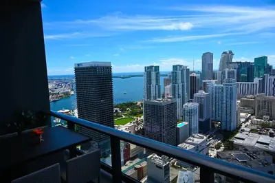 a view of a city skyline from a balcony at Magic Miami Penthouse Balcony, Insane Ocean & City Views Luxury,Pool,Spa,Gym in Miami