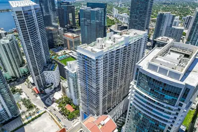 an aerial view of a city with tall buildings at Modern Studio with Balcony, Pool, Gym and Games in Miami