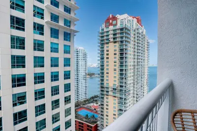 a view from the balcony of a building at Modern Studio with Balcony, Pool, Gym and Games in Miami
