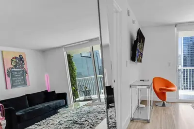 a living room with a couch and a table at Curated Sky Abode Ocean and City views, Sleeps 6 in Miami