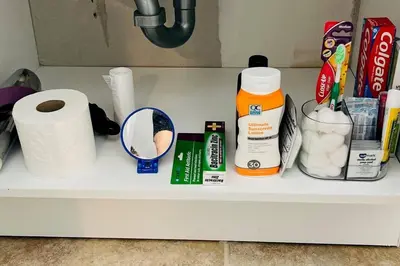a shelf with toilet paper and other items on it at Sunshine Cove in Lake Forest