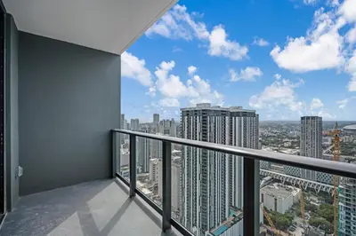 a balcony with a view of a city at Sky-High Views Pool and Fitness Center Access in Miami