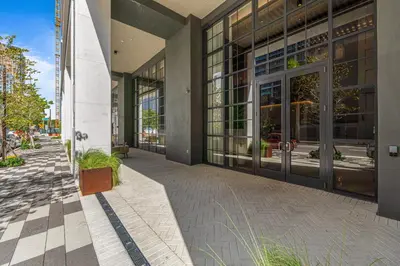 an empty sidewalk in front of a building at Luxury 45th-Floor Condo with Stunning City Views in Miami