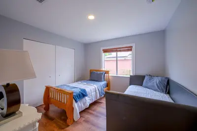 a bedroom with two beds and a window at House Genesis in Homestead