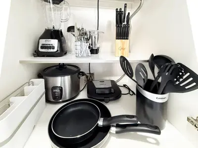a kitchen counter with a frying pan and utensils at Central King Studio Quiet & Close to Hard Rock in Miami Gardens