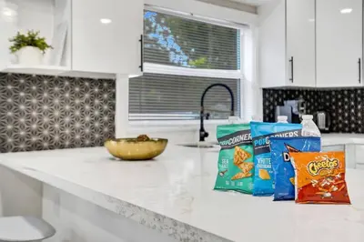 a kitchen counter with snacks and a bowl on it at Hollywood Lux Retreat in Hollywood