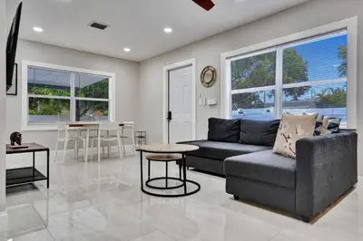 a living room with a couch and a table at Hollywood Lux Retreat in Hollywood
