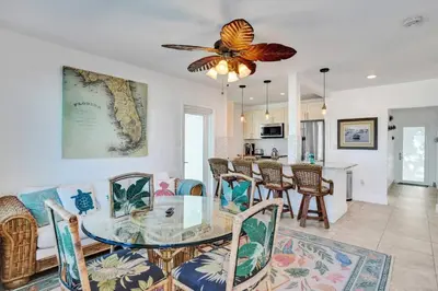 a dining room and living room with a glass table at Sunset Oceanfront Retreat in Hollywood