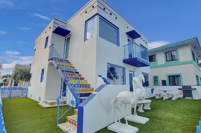 a house with a spiral staircase in a yard at Sunset Oceanfront Villa in Hollywood