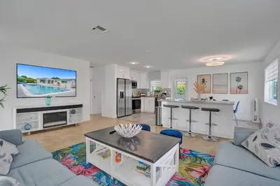 a living room with a couch and a table at Coastal Breeze Retreat in Pembroke Pines